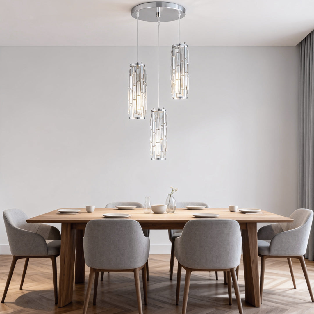 Crystal pendant lights in a modern dining room with warm ambient lighting