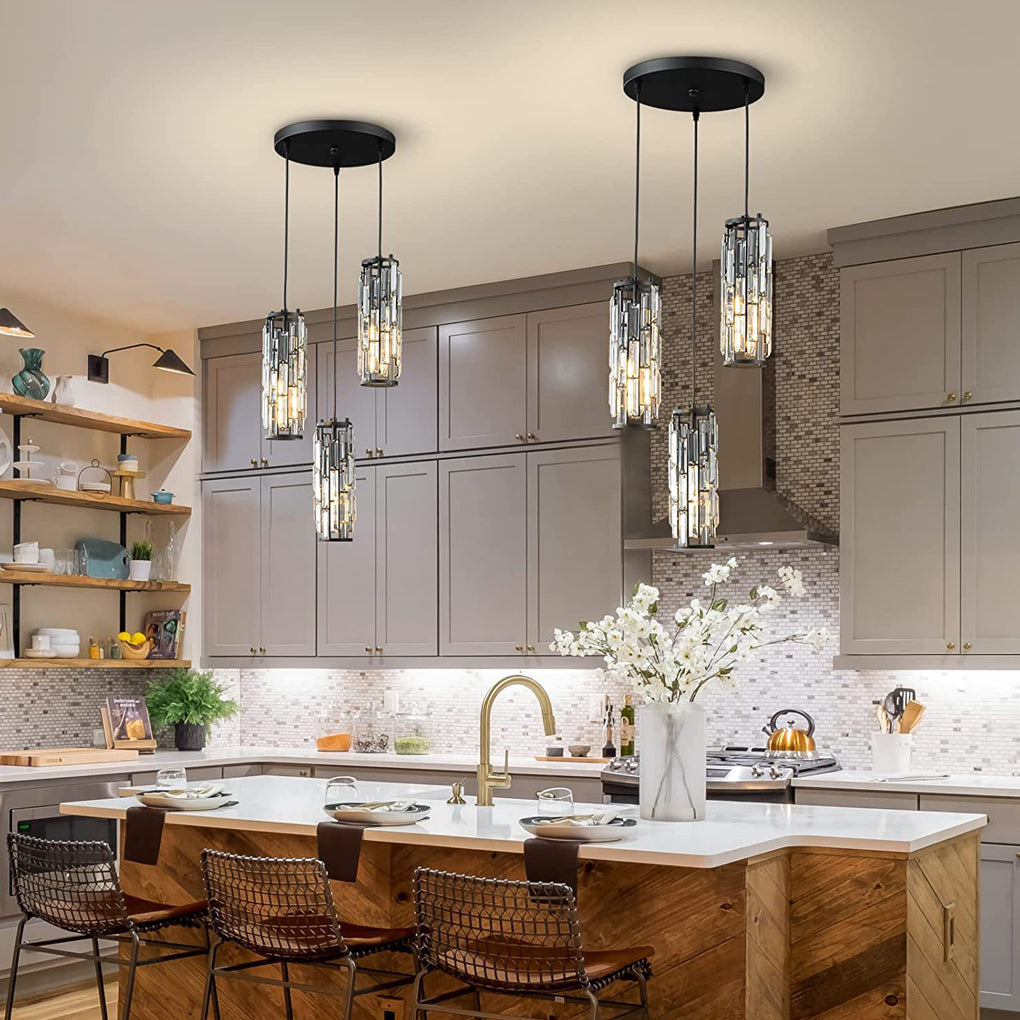 White kitchen island lit by mini crystal pendant lights in a modern interior