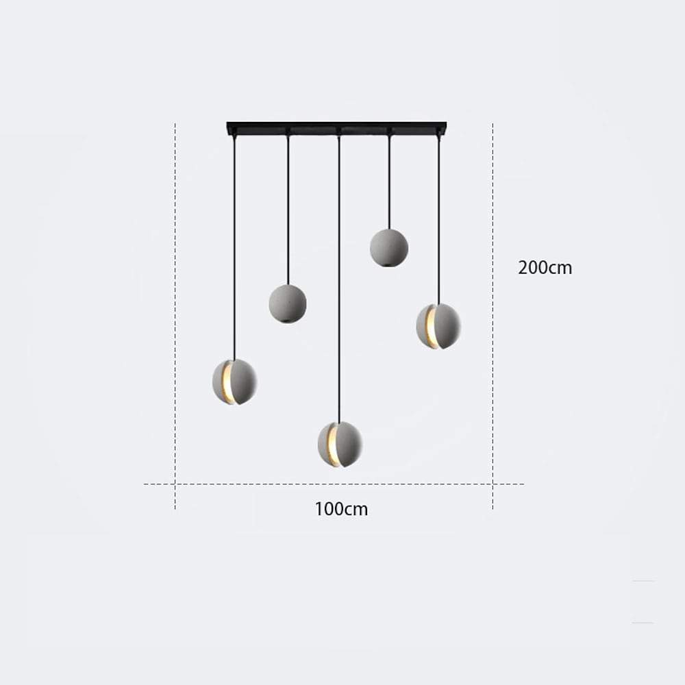 Aureon globe pendant light in 6-inch variant above a bedside table in a minimalist bedroom
