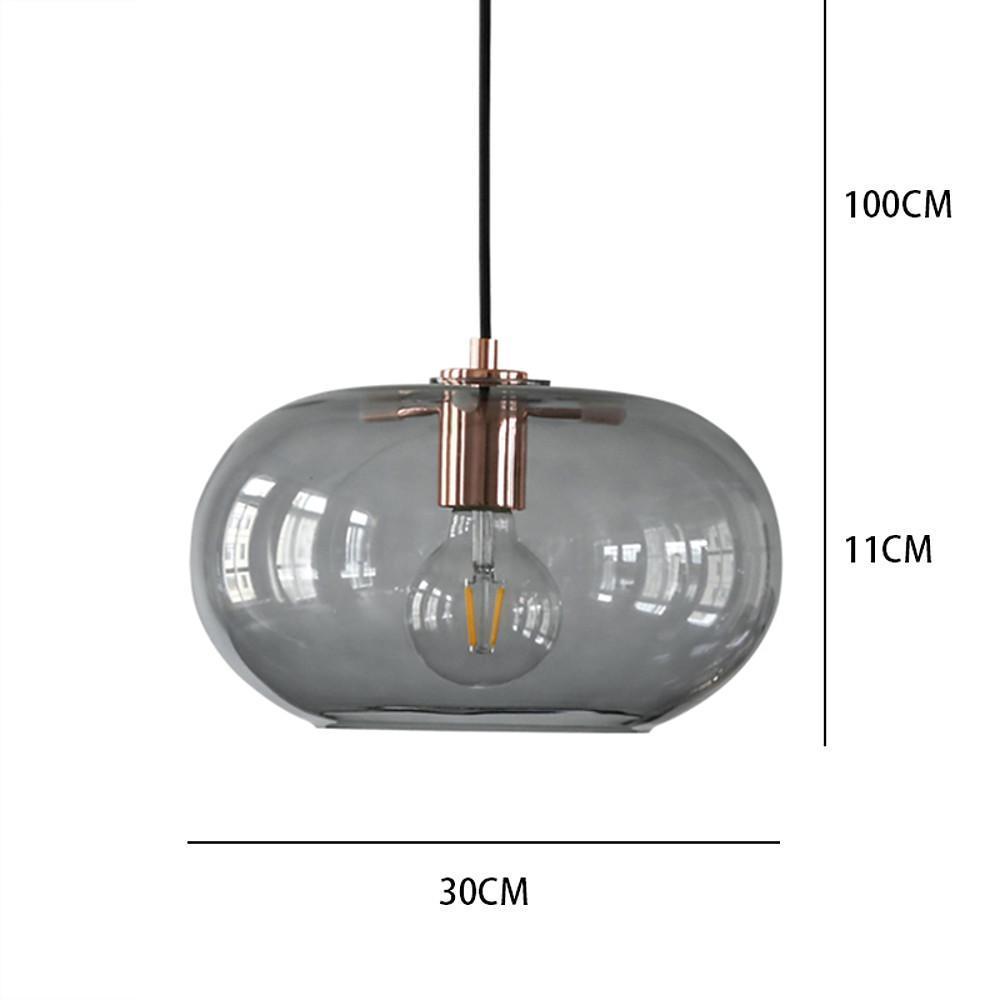 Aureon electroplated glass pendant light above a dining table in a contemporary interior