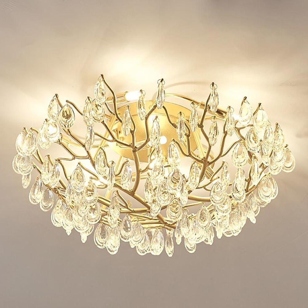 Auréline crystal ceiling light above a dining table in a contemporary interior