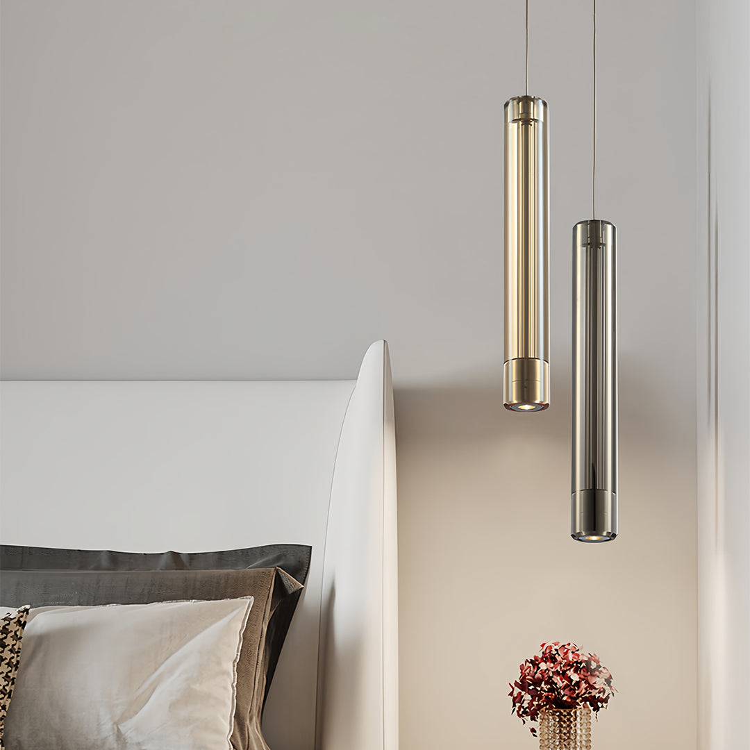 Pair of modern crystal pendant lights in a neutral bedroom setting
