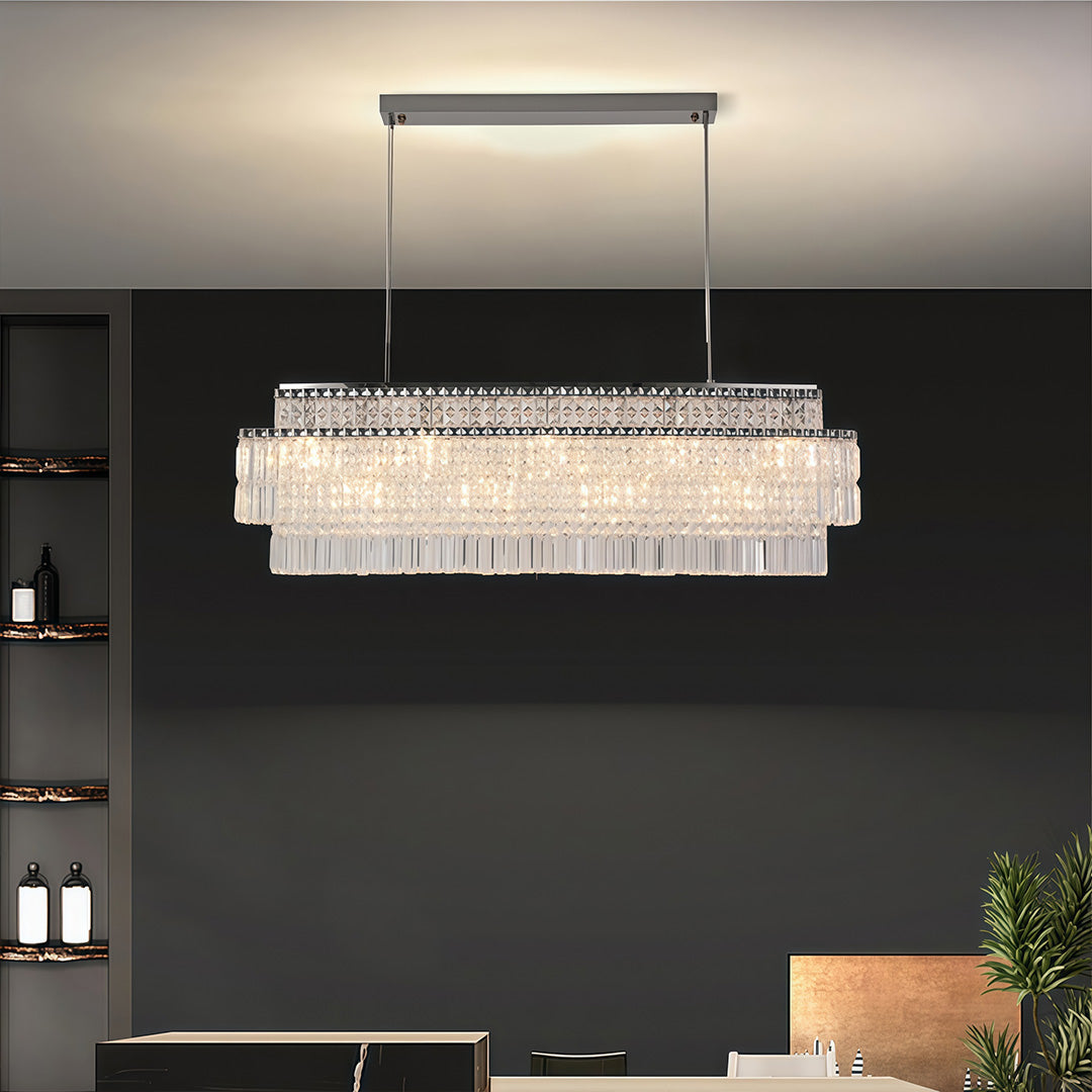 Rectangular crystal chandelier above a dining table, black wall background, pendant ceiling light
