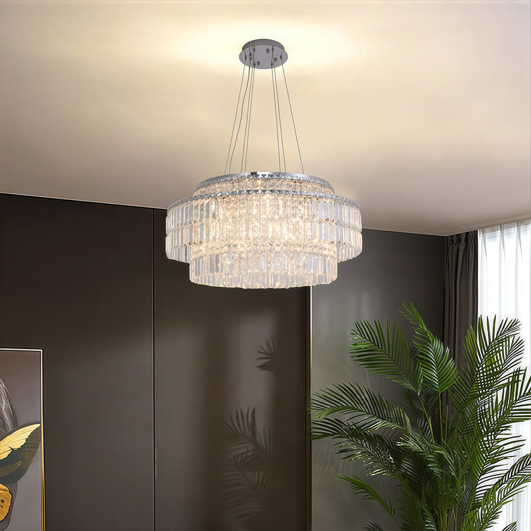 Round crystal chandelier in a modern living room with dark walls, contemporary interior setting