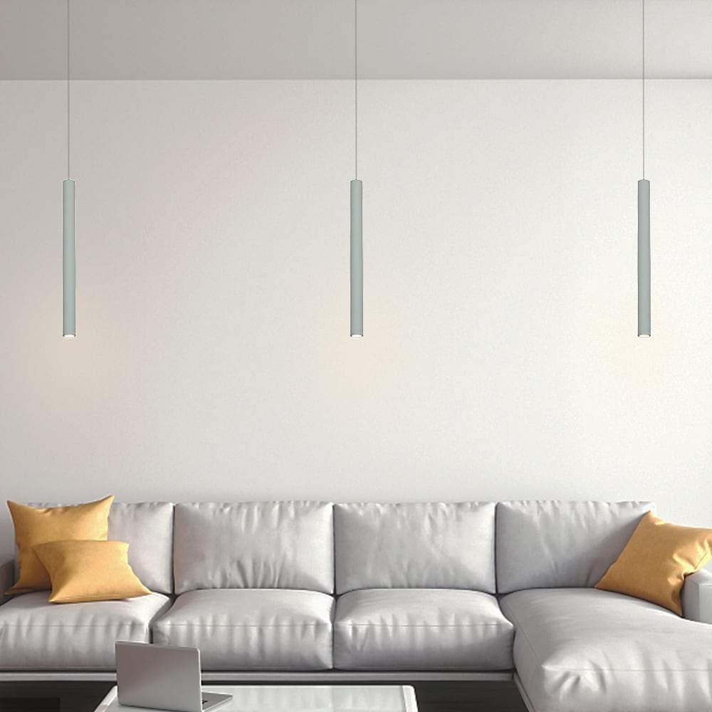 Aureon modern cylindrical pendant light casting warm white downlight in a kitchen setting