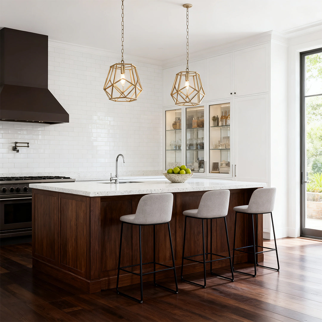 Small geometric brass cage gold pendant light above a kitchen island