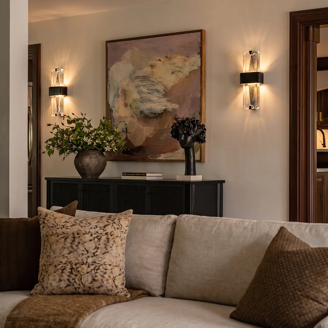 Niva textured resin wall light above a console table in a contemporary hallway
