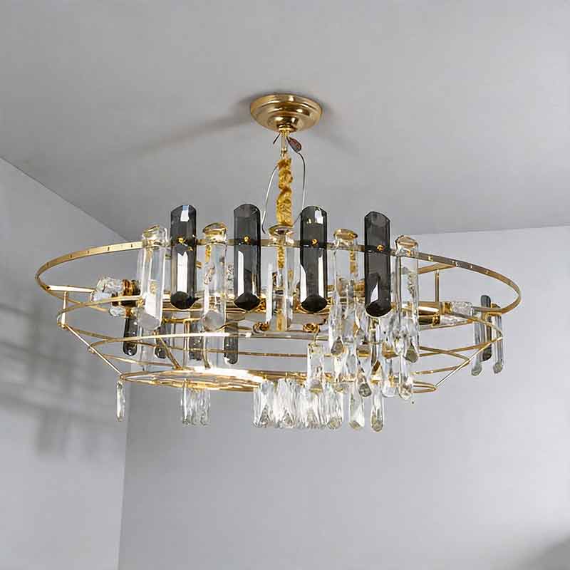 Auréline crystal drum chandelier unlit, hanging from a white ceiling