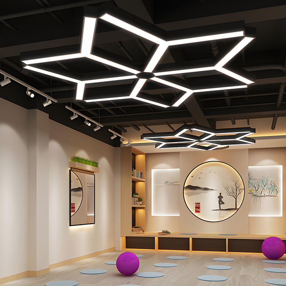 Y-shaped modular linear pendant light installed in a creative commercial ceiling space