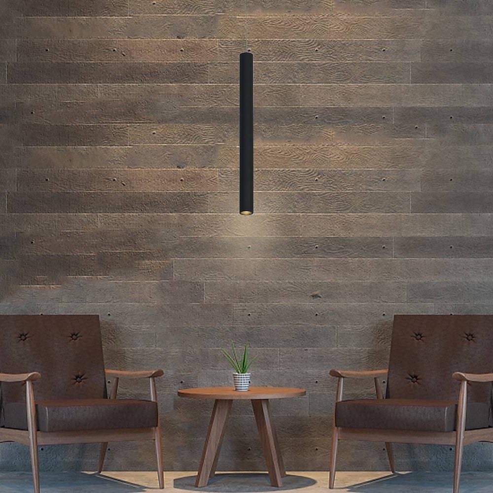 Aureon slim black pendant light with integrated LED, hanging in a modern dining room