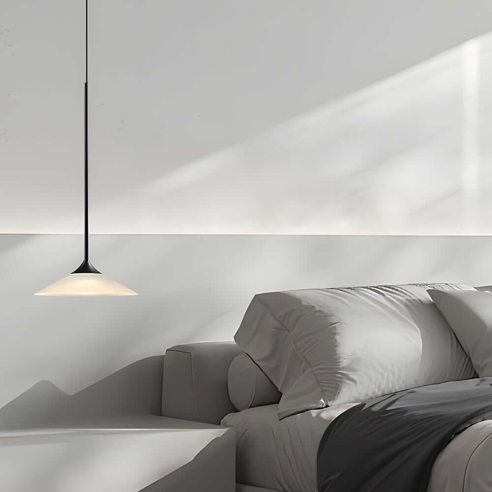 Aureon pendant light illuminated showing warm 3000K downward light in a dining room