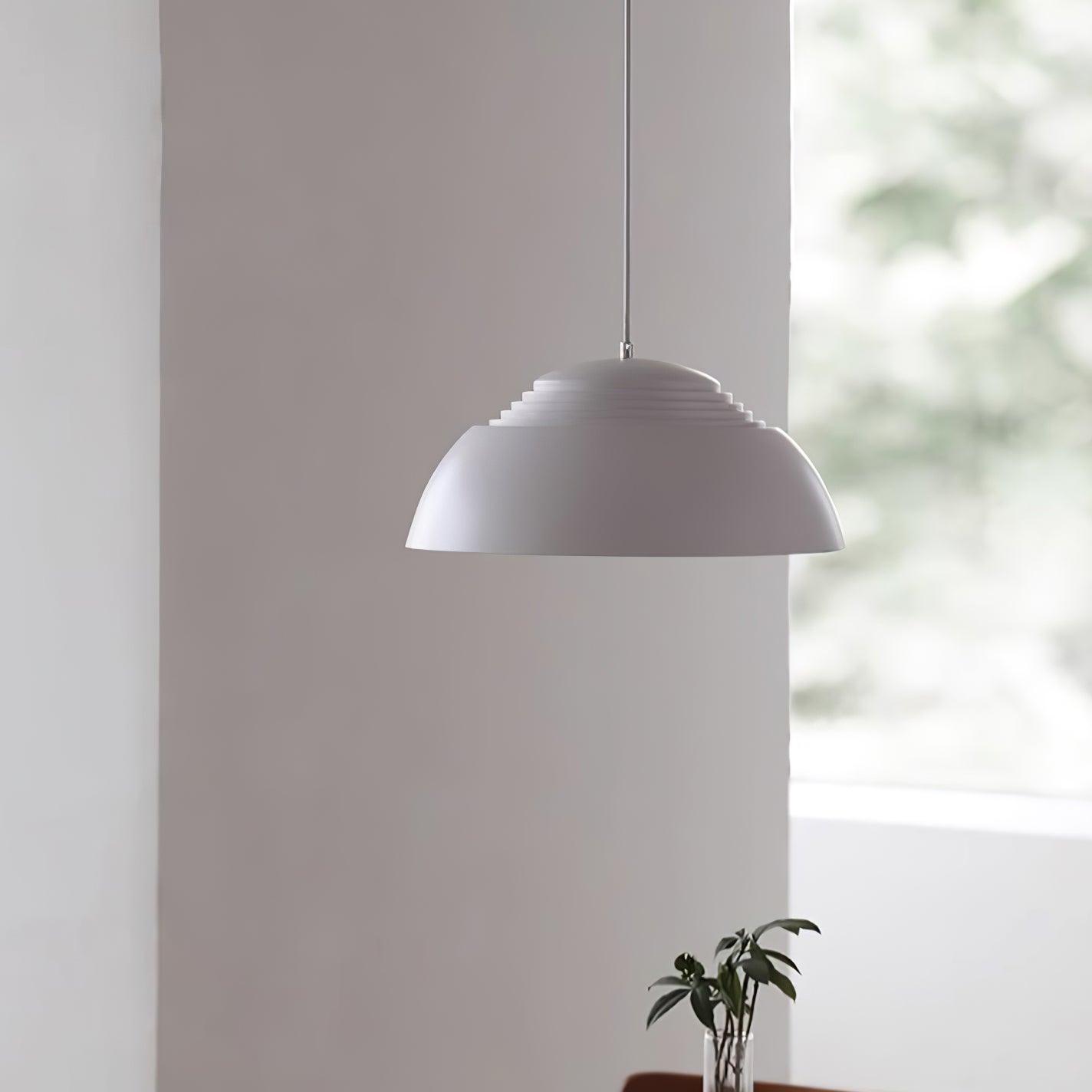 Vantara aluminium ceiling pendant in matte black in a modern studio or office space