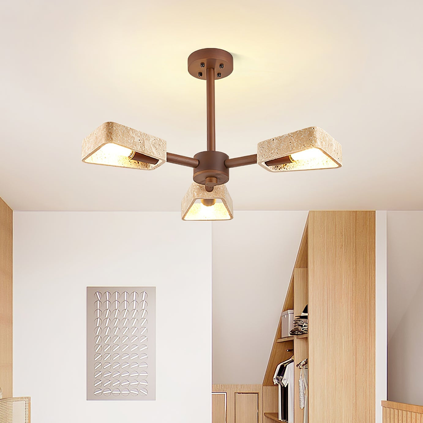 Japandi stone chandelier with natural travertine and wood finish in a neutral home interior