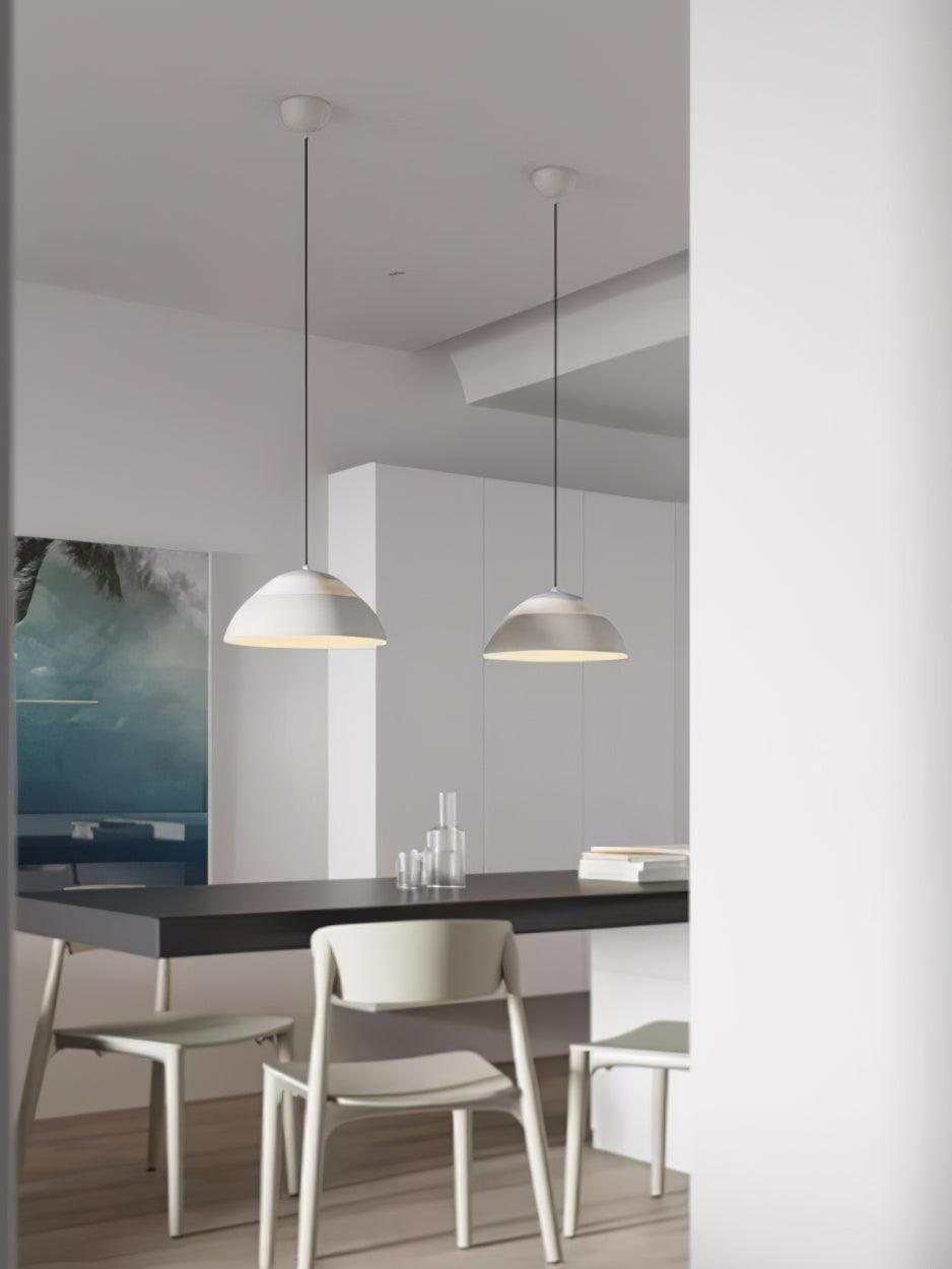 Vantara ridged pendant light in matte white above a bathroom vanity in a dry indoor setting