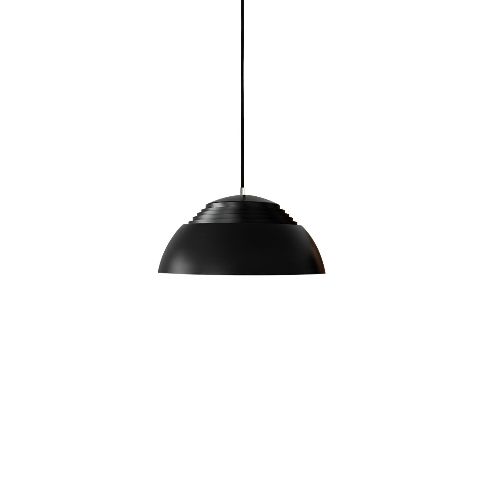 Vantara ridged aluminium drum pendant light in matte white above a dining table in a modern interior