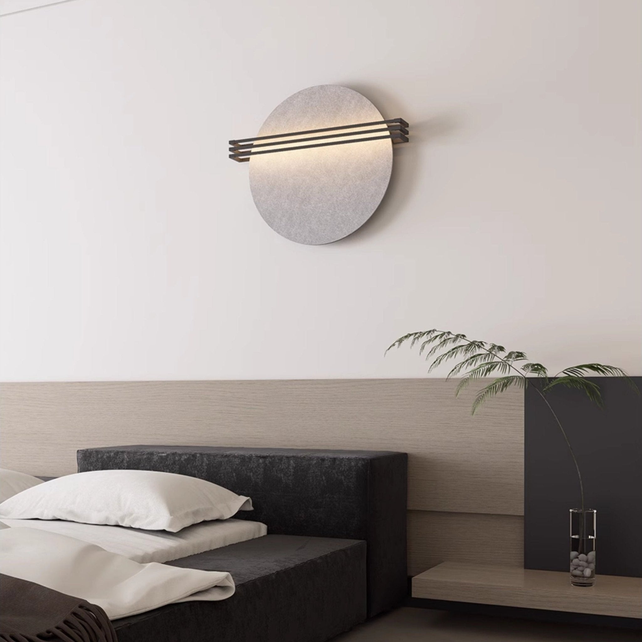 Vantara orange felt wall sconce casting a warm ambient glow in a hallway