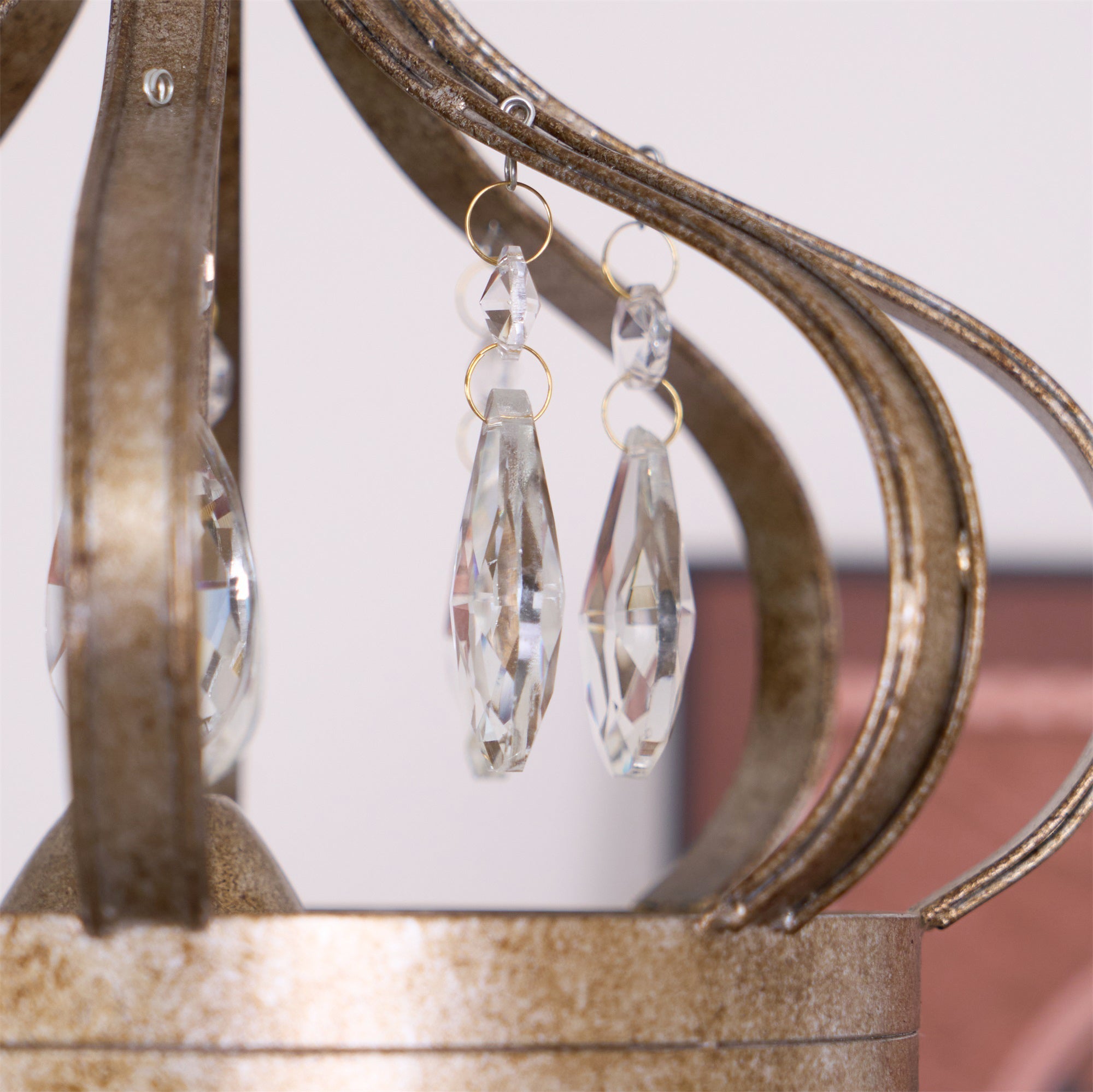 Large Vantara chandelier in antique silver hanging in a high-ceiling hallway