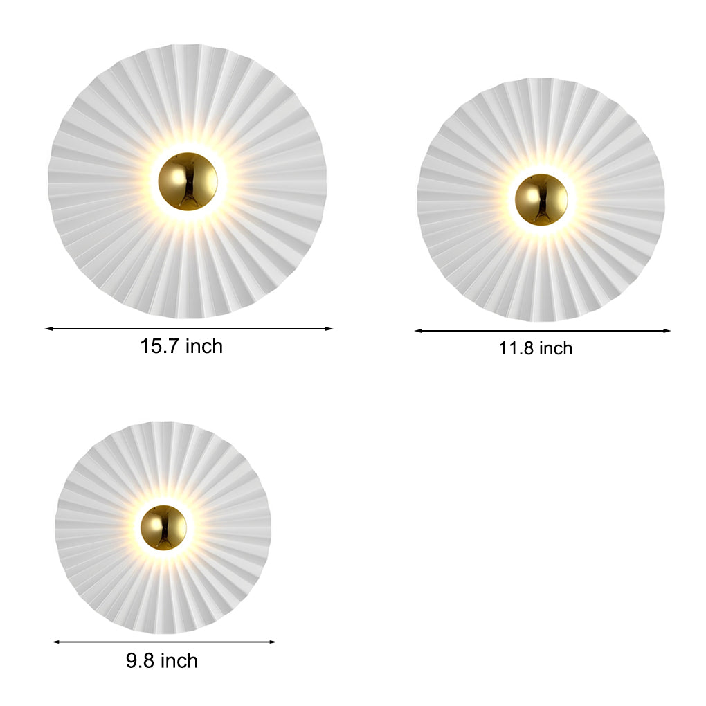 Two Alure lotus leaf wall lights grouped together in different sizes on a bedroom wall