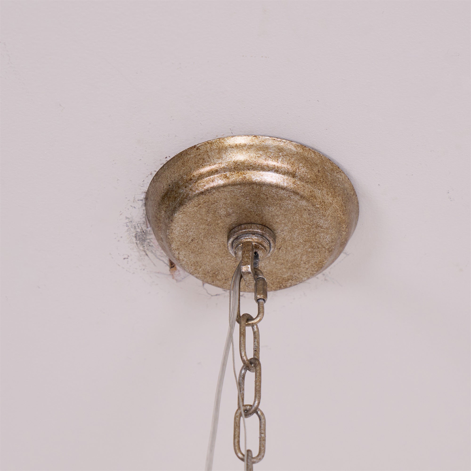 Vantara chandelier layered crystal drops in antique gold finish, close-up