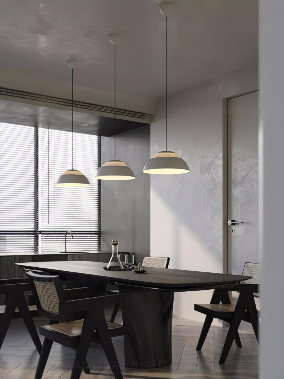 Vantara aluminium pendant light in matte black in a contemporary entryway with a high ceiling