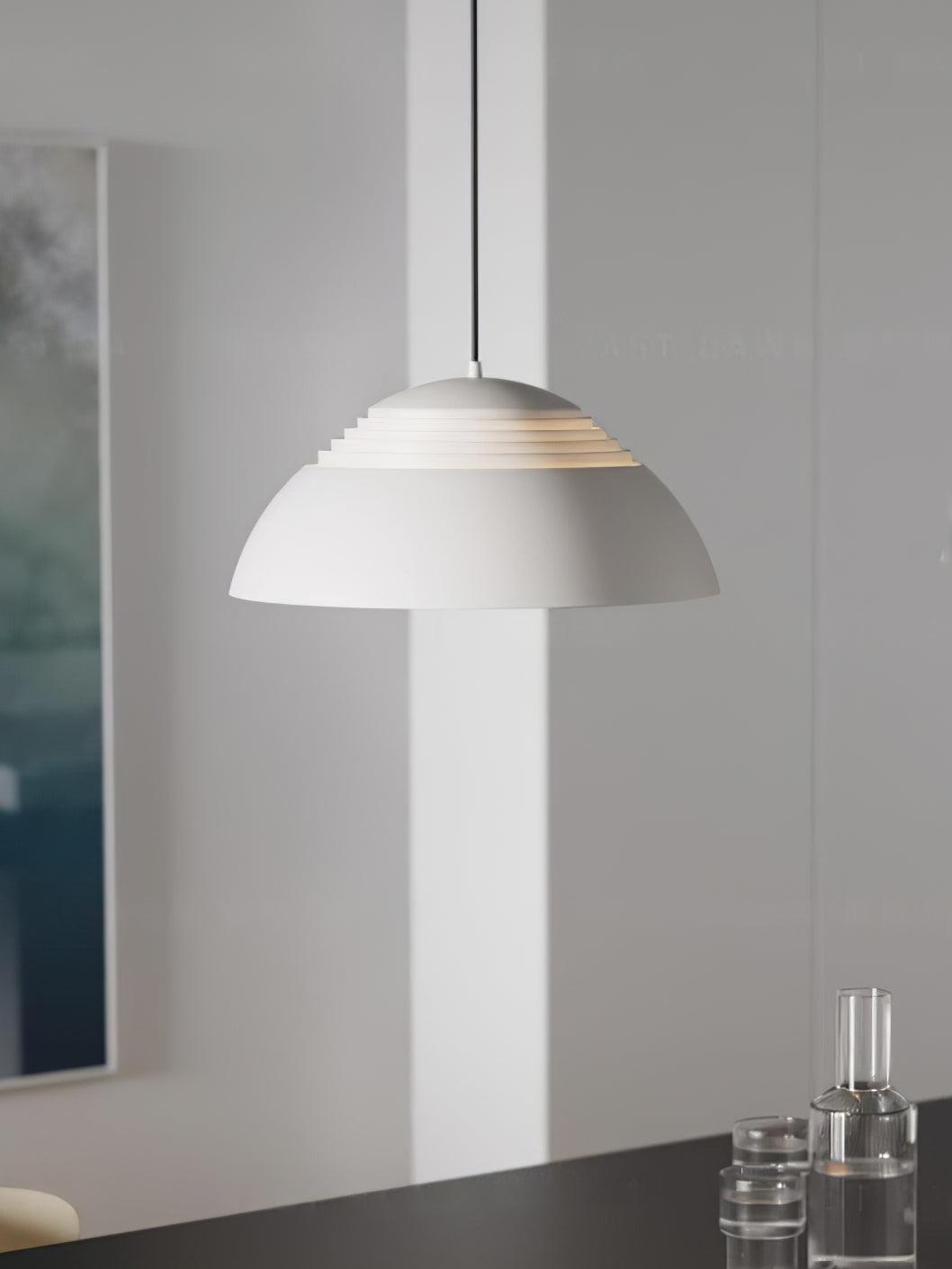Vantara drum pendant light in matte black against a white ceiling showing clean canopy detail