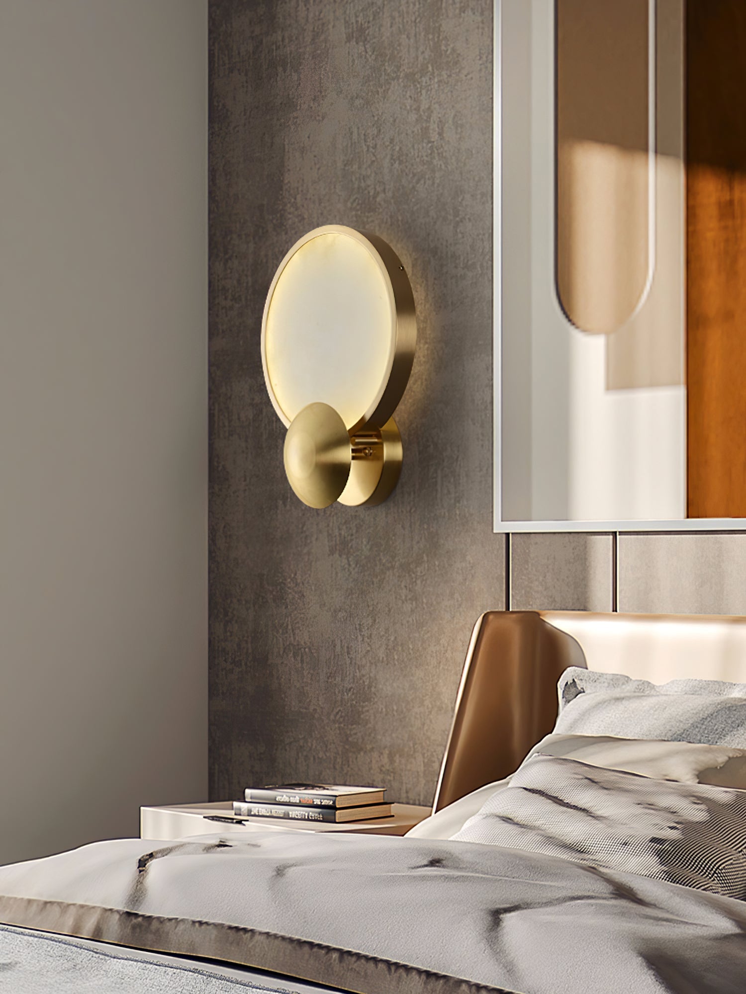 Sayo wall light with brushed gold frame in a dining room with warm ambient lighting