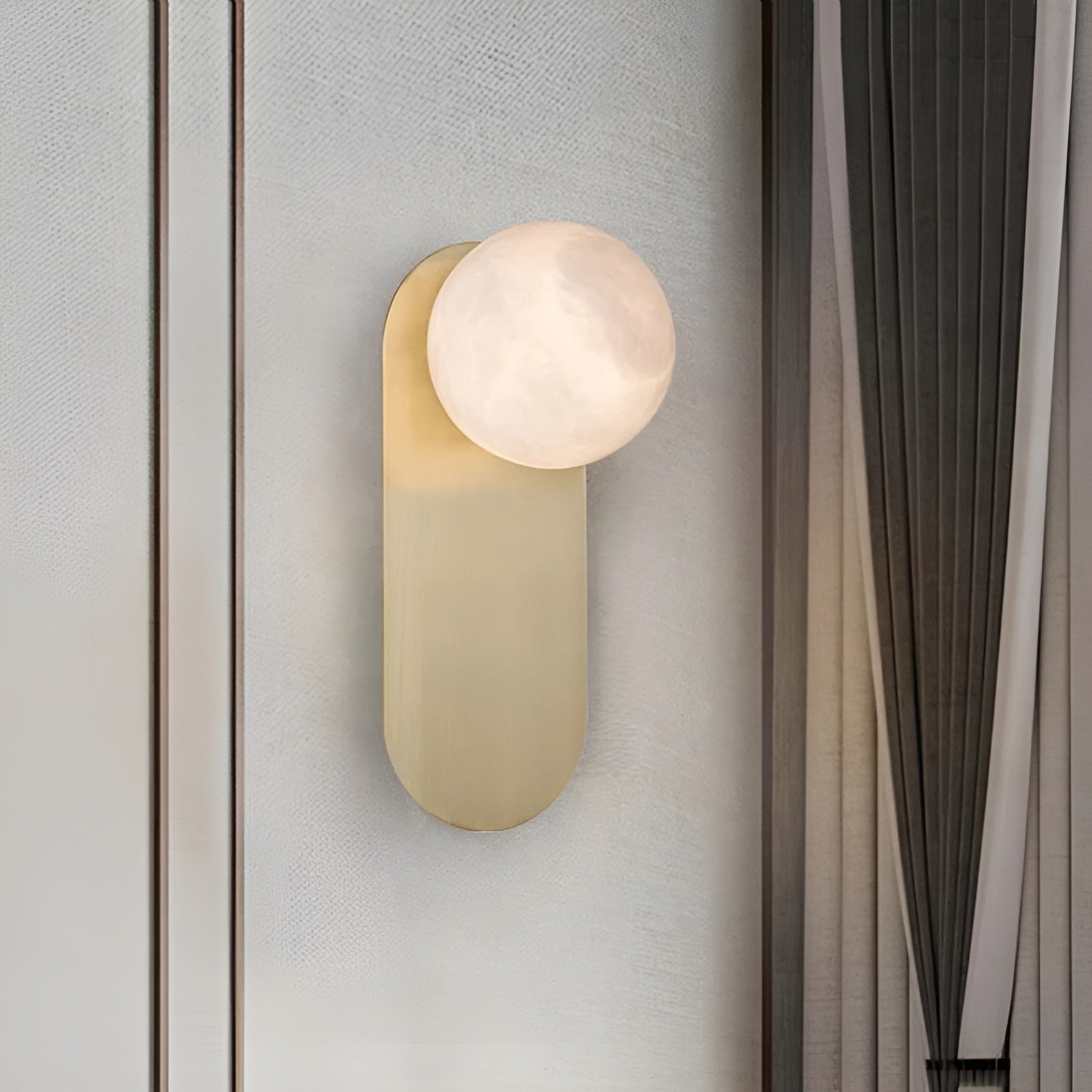 Savio Savio Wall Sconce on a warm-toned plaster wall in a minimal interior