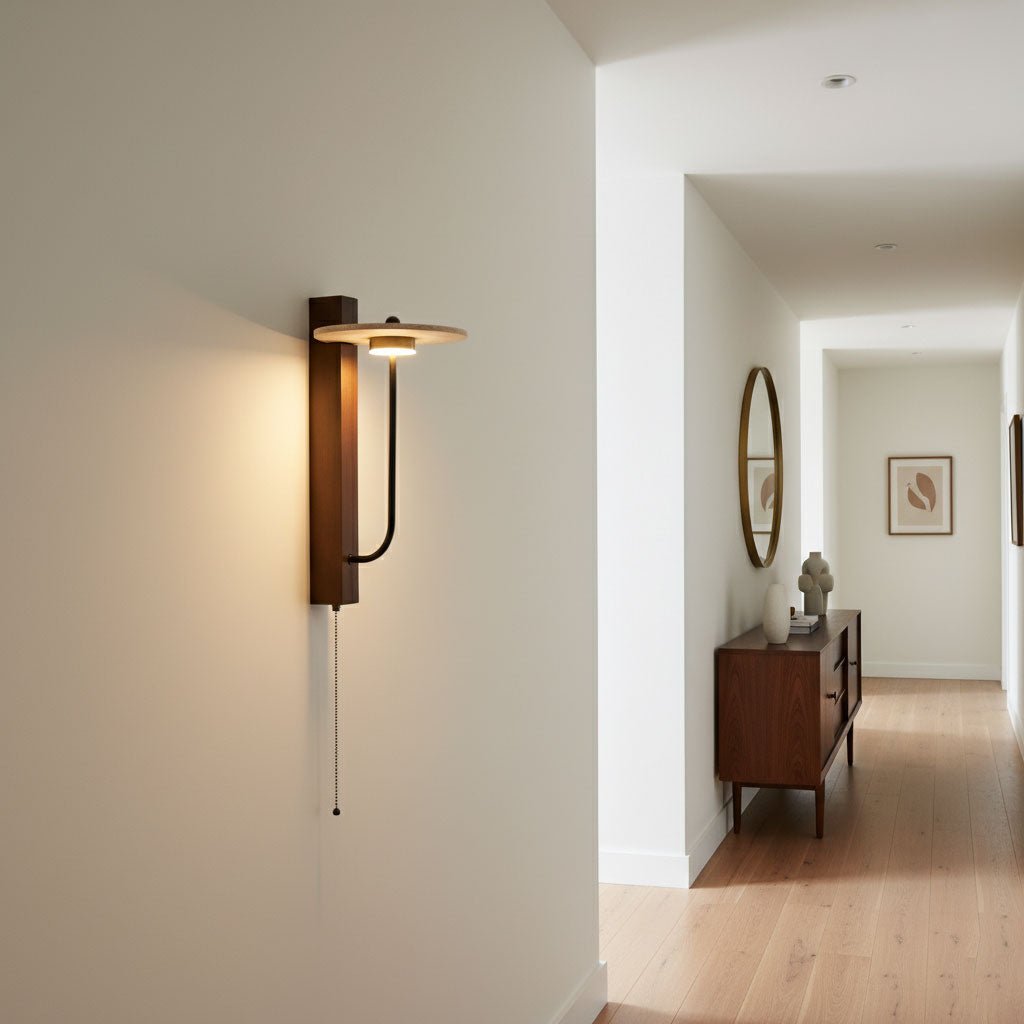 Sumi travertine wall light casting warm glow through natural stone in a bedroom