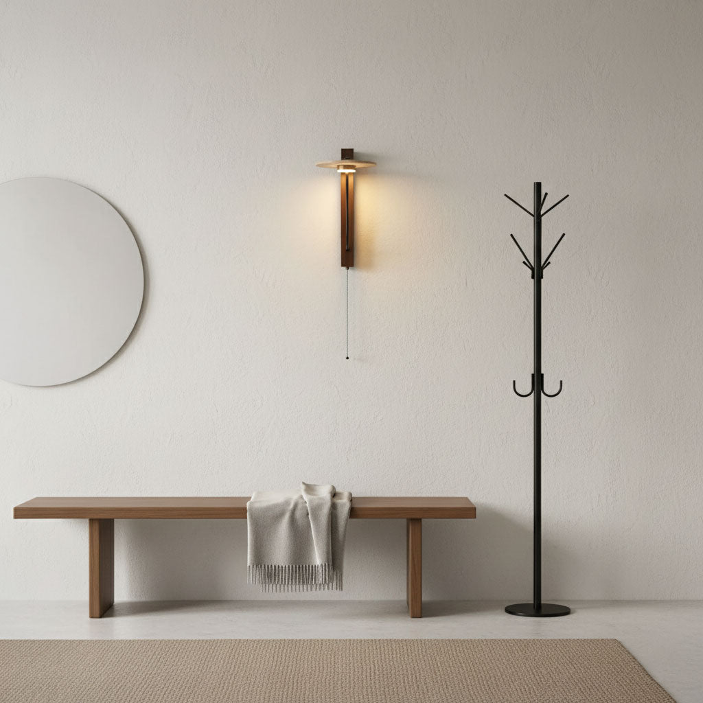 Sumi travertine arm wall light in hallway with warm light temperature