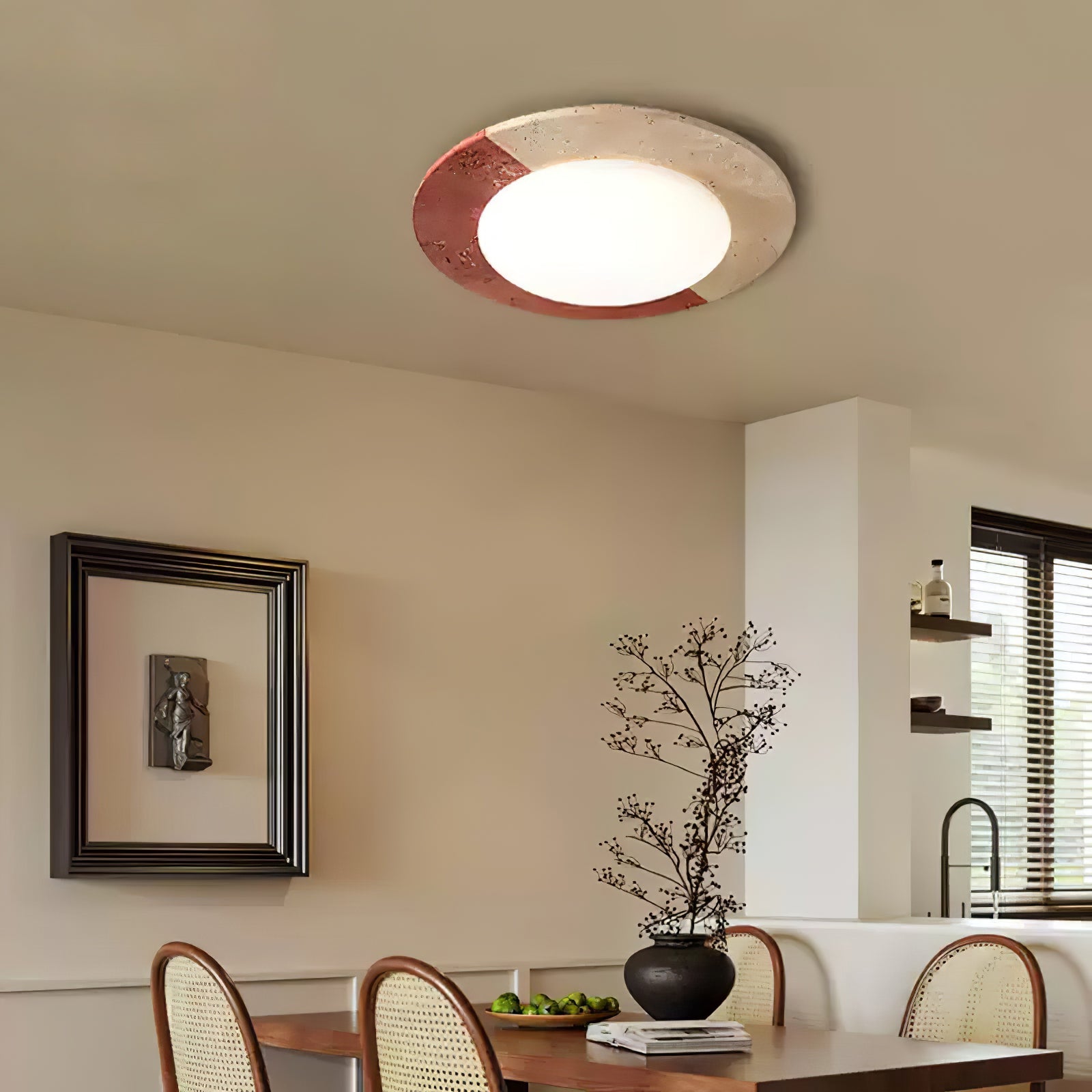 Nami stone ceiling light with warm lighting in a reading nook