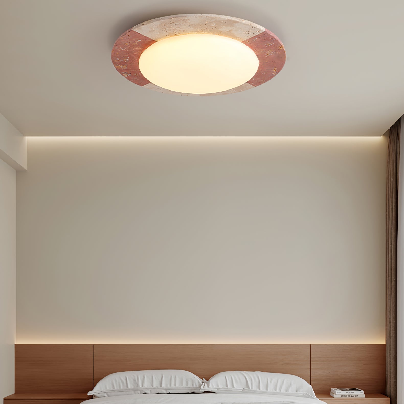 Travertine ceiling light casting warm 3000K ambient light in a bedroom