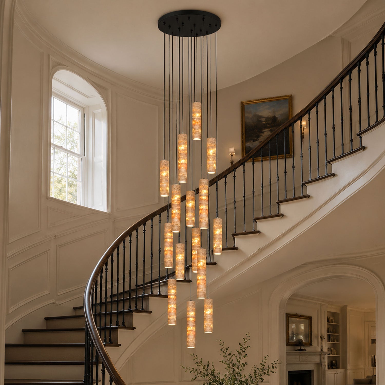 Eleven-head travertine cylinder pendant light in a contemporary hotel lobby interior