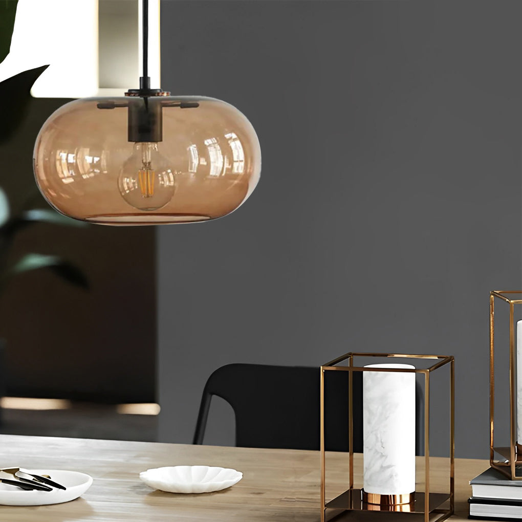 Aureon glass pendant light close-up showing electroplated metal body and glass shade detail
