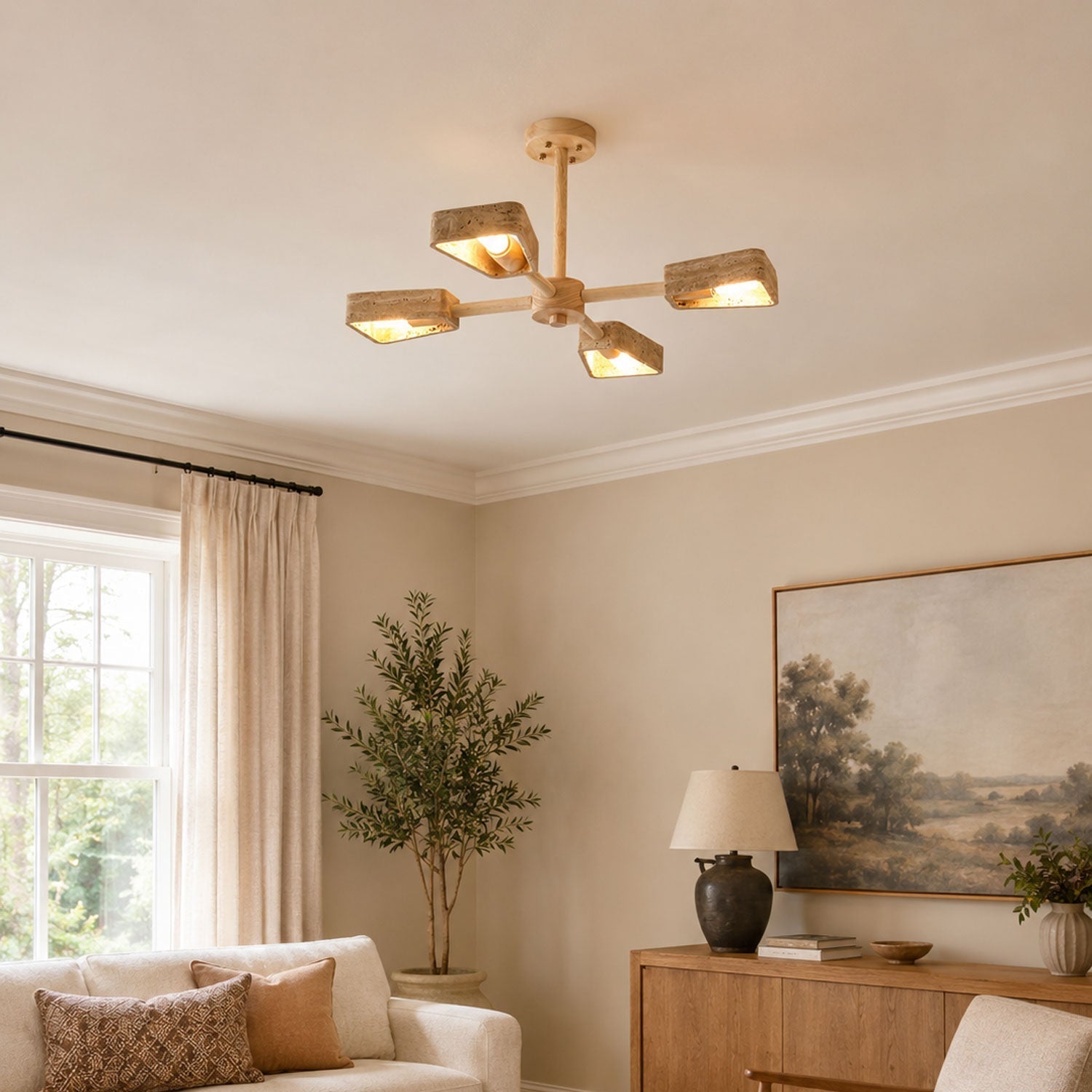 Tomoe stone chandelier with warm white bulbs illuminated in an evening dining room setting