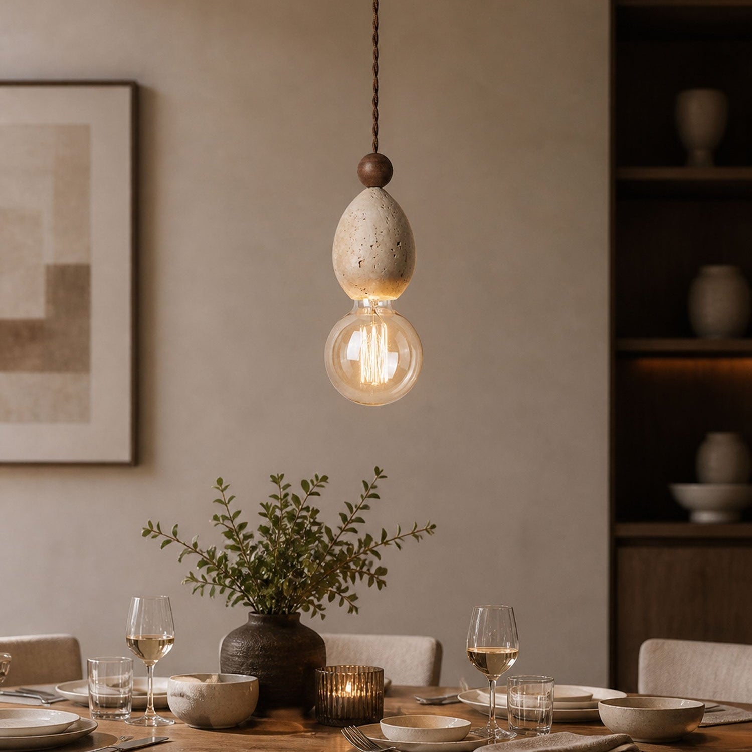 Tsuki travertine pendant light hung above a kitchen island in a minimal Japandi interior