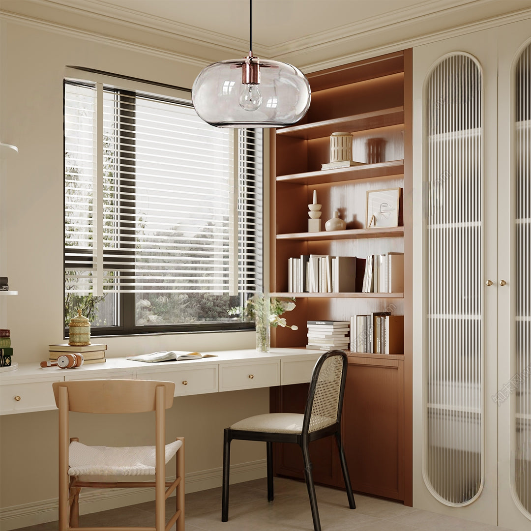 Aureon glass pendant light in amber shade, warm ambient glow in a dining room setting