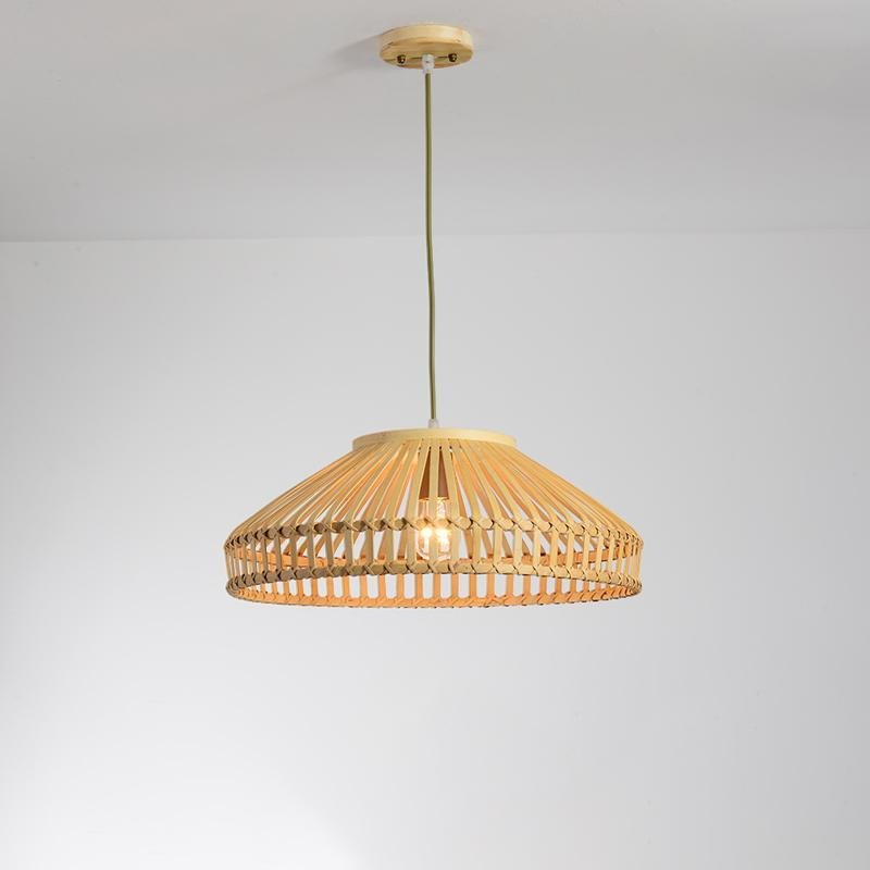Aureon bamboo pendant light in wide diamond shape above a dining table in a modern interior