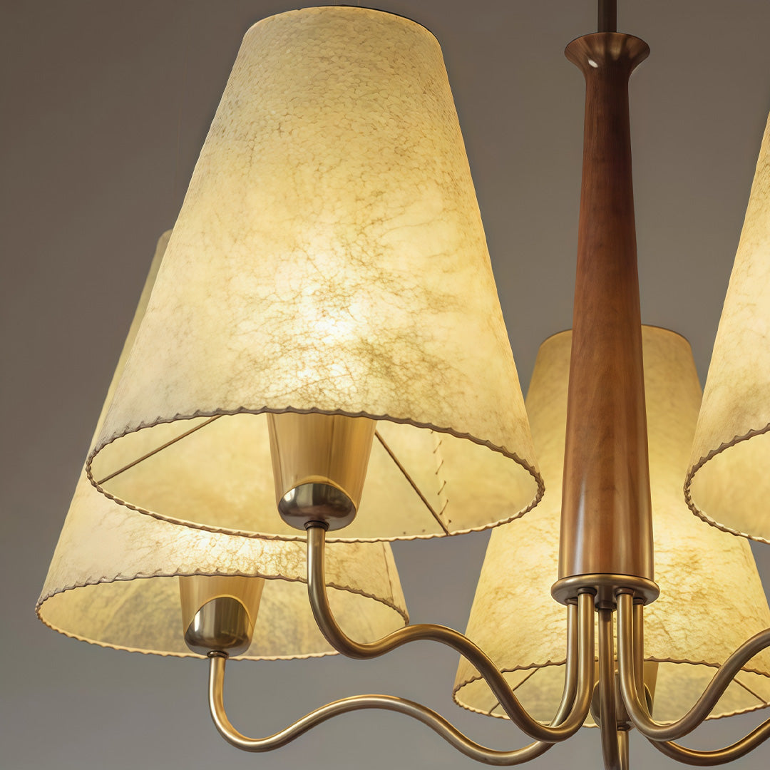 Auréline five-light chandelier with tri-colour dimming, lit in warm 3000K tone above a dining space