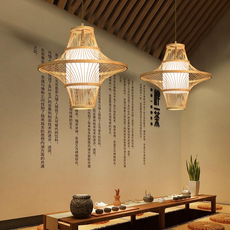 Two Aureon woven bamboo pendant lights above a kitchen island in a modern interior