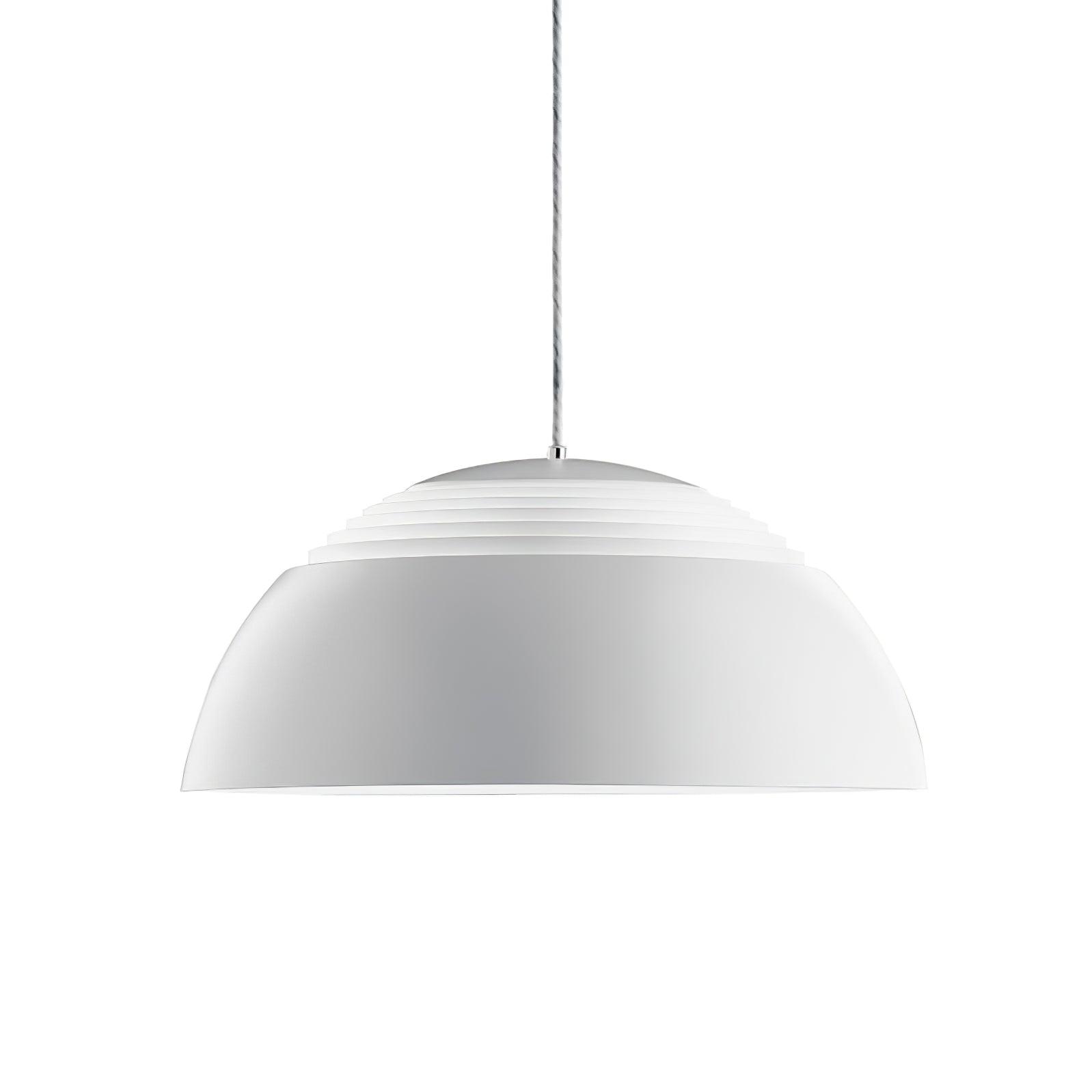 Vantara drum pendant light in matte black paired with warm wood tones in a modern kitchen