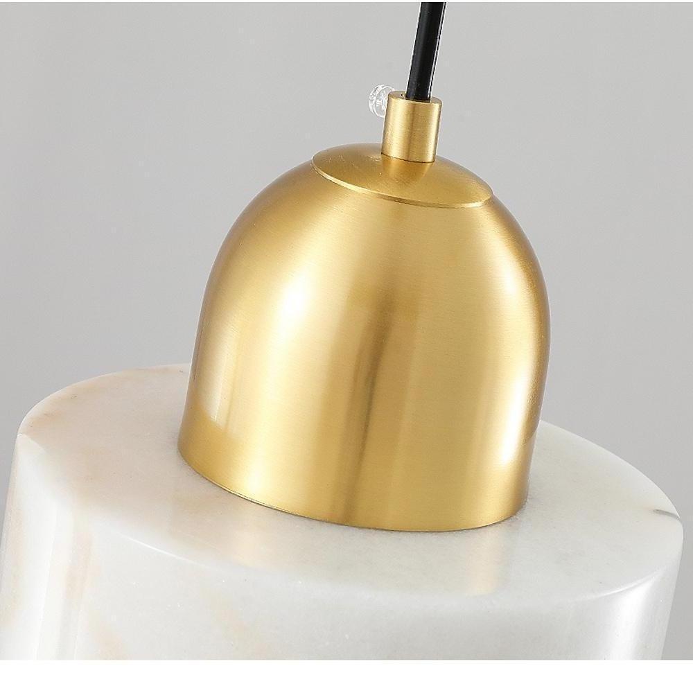 Aureon mini pendant light with adjustable cord, installed in a modern living room