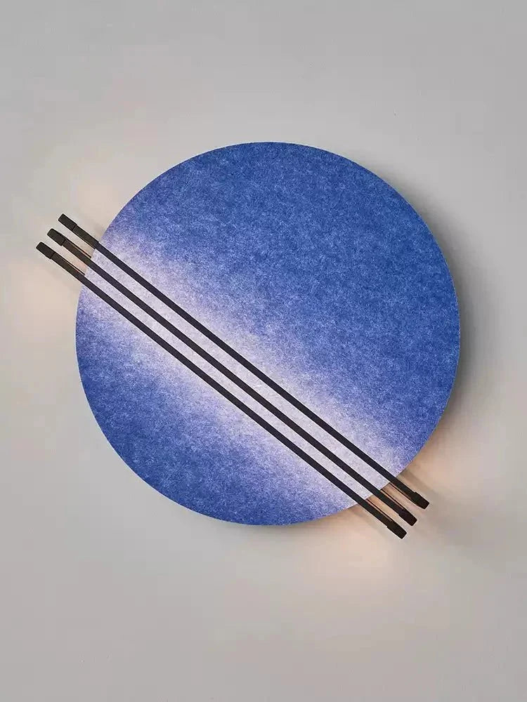 Close-up of black metal rod detail across the orange felt shade of the Vantara wall sconce