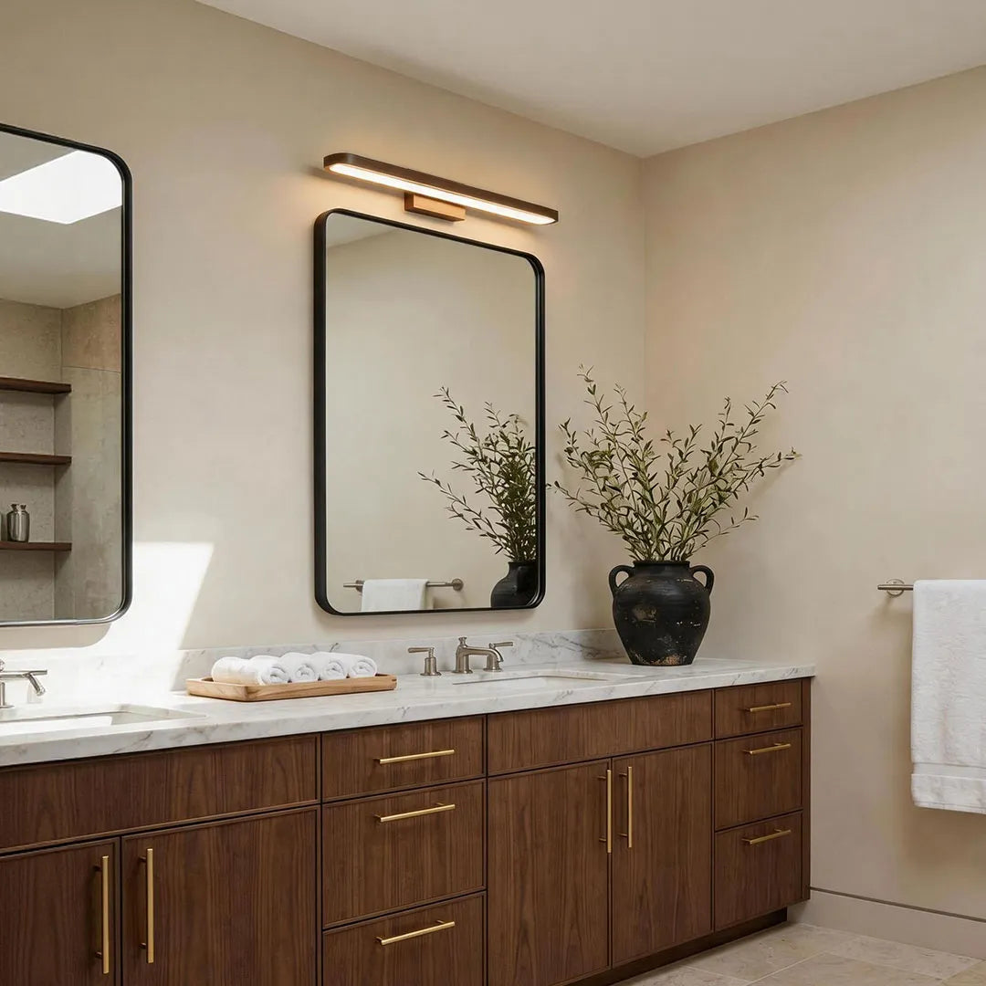Viora vanity bar light in a dark wood bathroom, warm white colour temperature