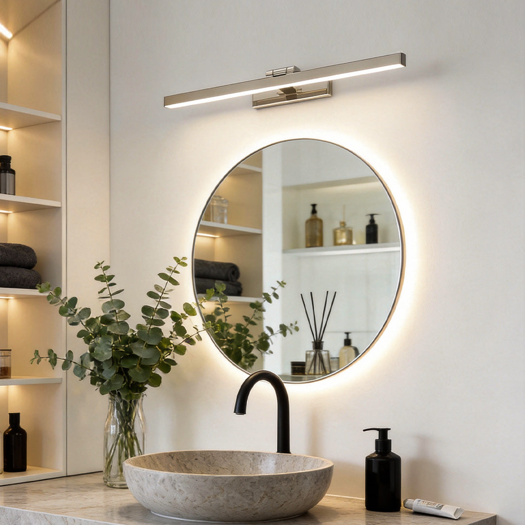 Viora bathroom vanity light bar illuminating a round mirror in a modern bathroom