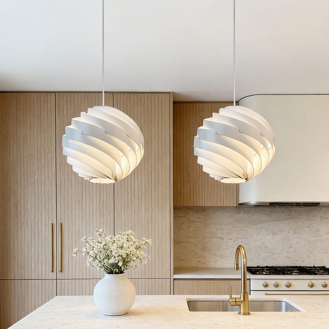 Beautiful white Aureon swirl pendant light above a kitchen island, modern spiral ceiling light