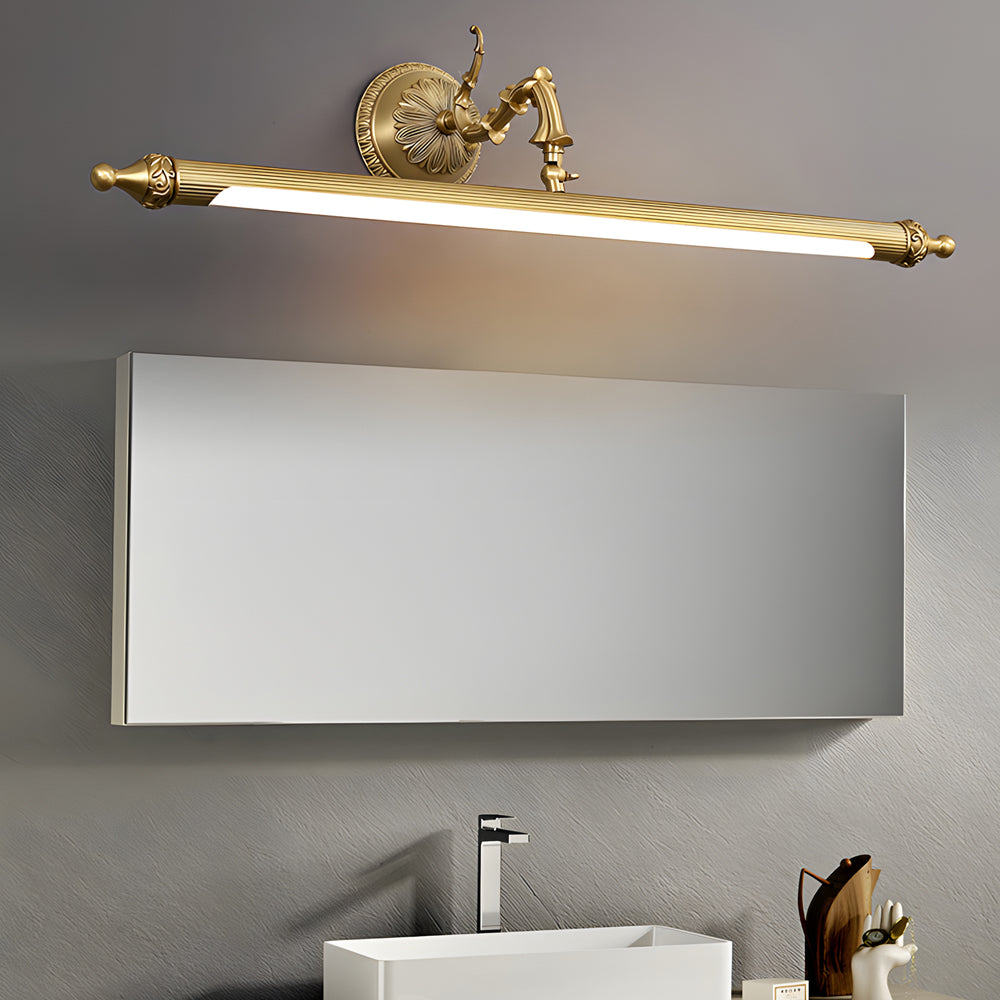 Brushed gold LED vanity light bar above a bathroom mirror in a modern interior