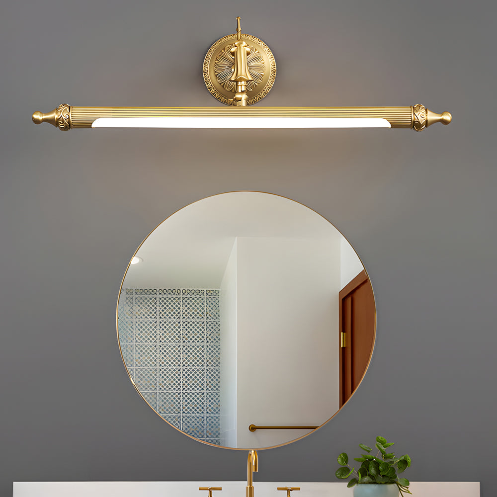 Viora copper vanity light bar mounted beside a round bathroom mirror