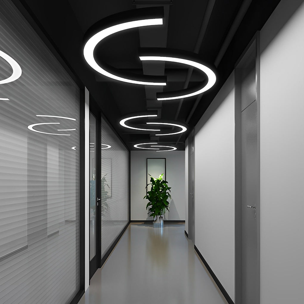 Aureon curved pendant light in a contemporary hallway, showing single-unit arc silhouette