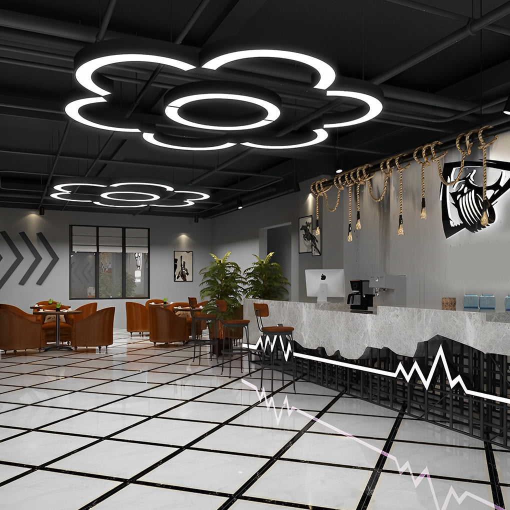 Aureon arc pendant light in a creative workspace with minimal decor and high ceilings