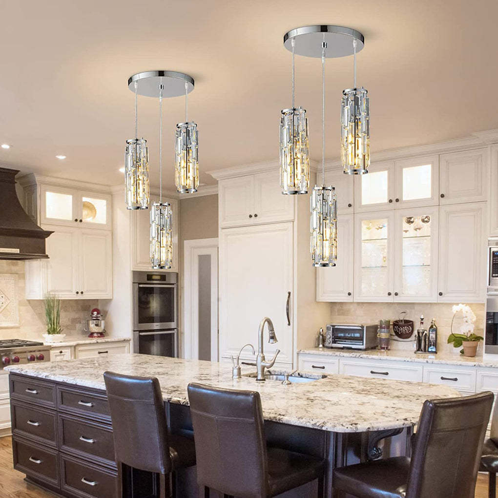 Chrome crystal pendant lights above a granite kitchen island